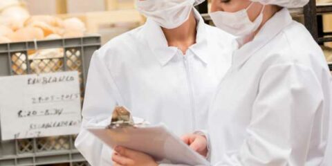 two food inspectors in a bakery